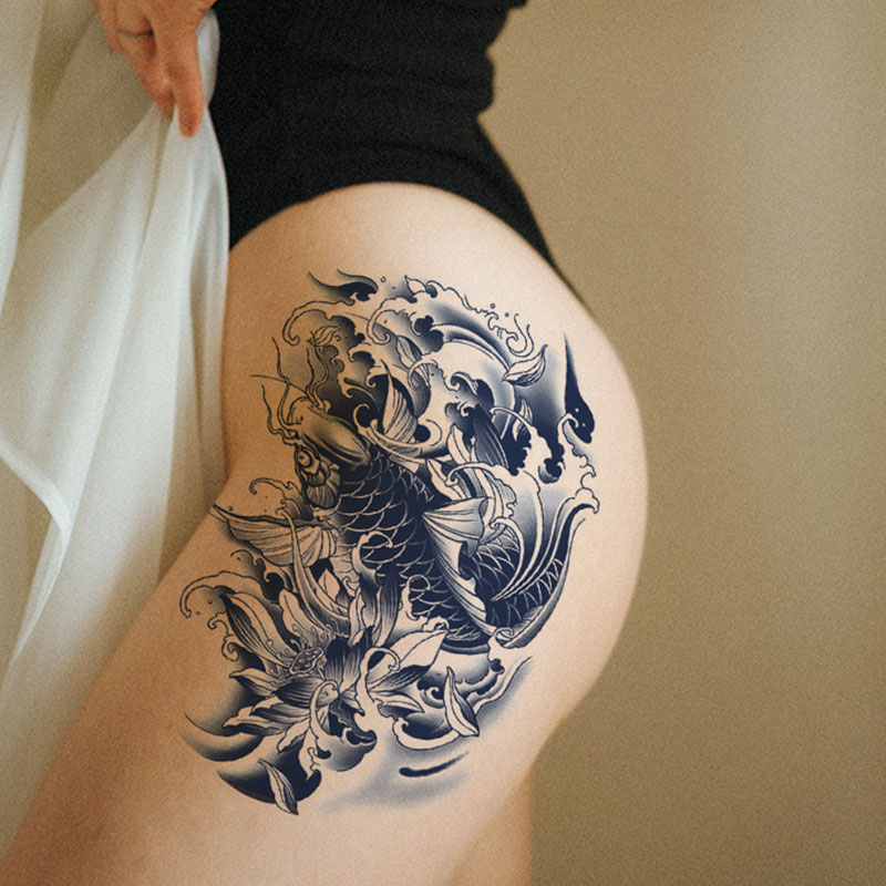 floral thigh tattoo