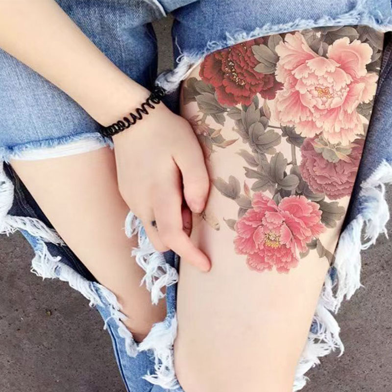 tattoo on thigh roses